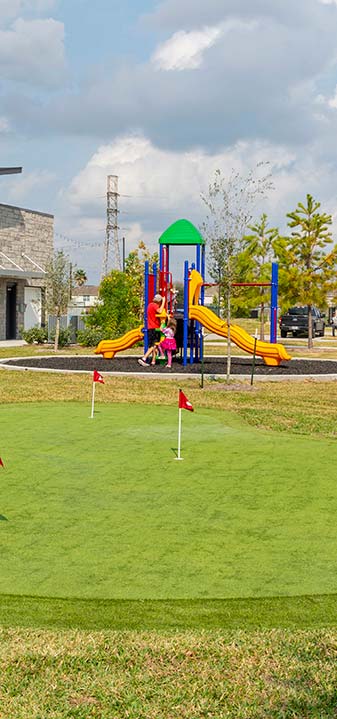 Golf putting green and kids play park at Jet Stream Waller RV Park in Houston Texas